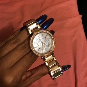 Rose Gold MK watch.