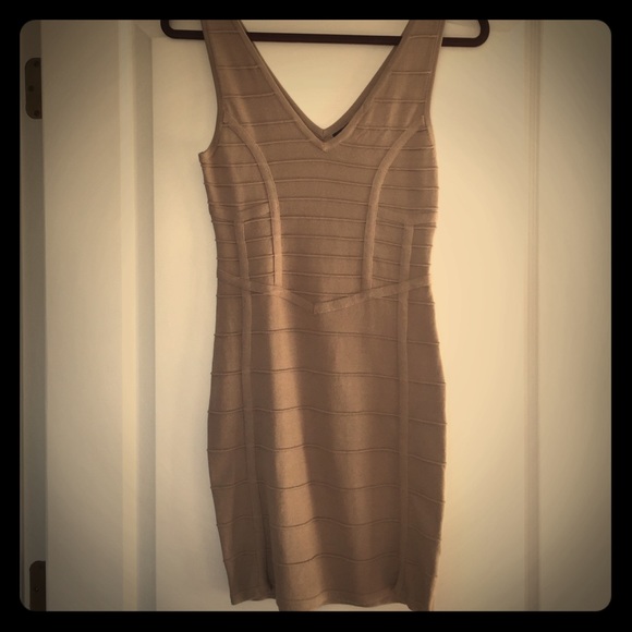 Bebe sexy body on tan dress