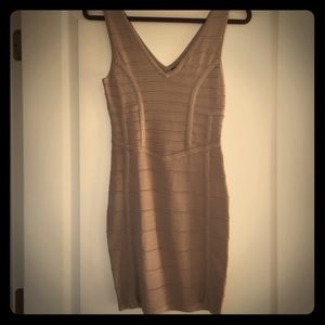 Bebe sexy body on tan dress