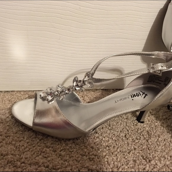 Silver dress sandals.  Never worn,  size 6