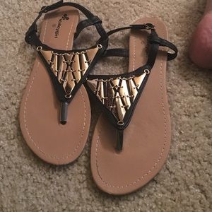 Black and gold flat sandals
