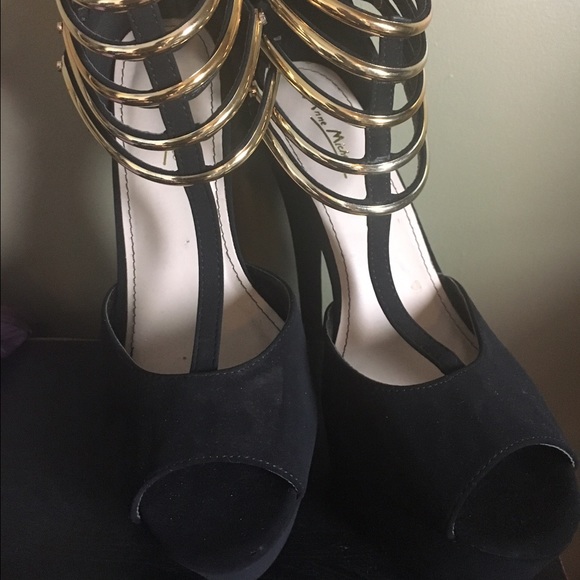 Black and gold high heels