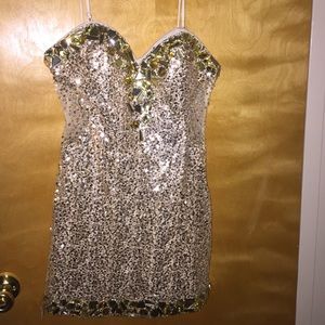 Bedazzled Gold Dress with seethrough back.