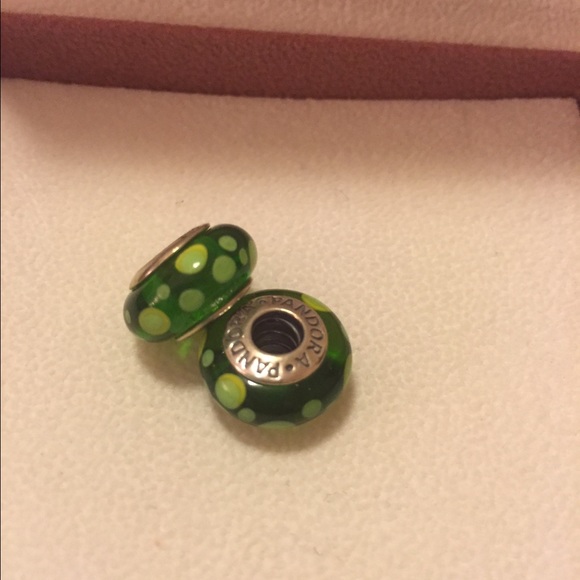 Two green, glass, Pandora beads