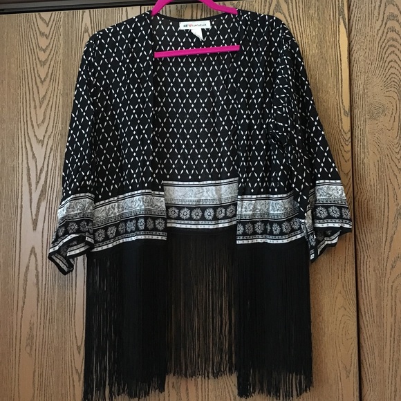 Black and white pattern kimono with fringe bottom.