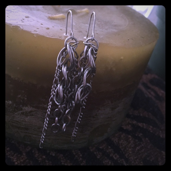 Dangling chain earrings.