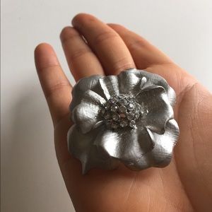 SOLD Brooch, silver flower with rhinestone center