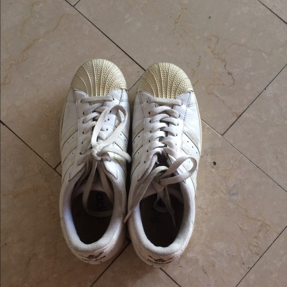 All white adidas superstars