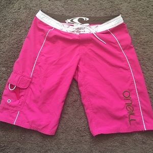 Bright pink O'Neil board shorts