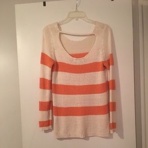 Orange and tan sweater.