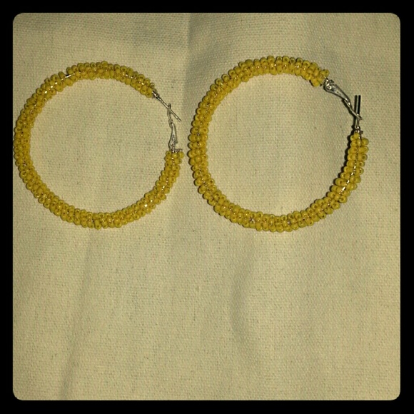Sexy yellow hoop earrings for pierced ears .