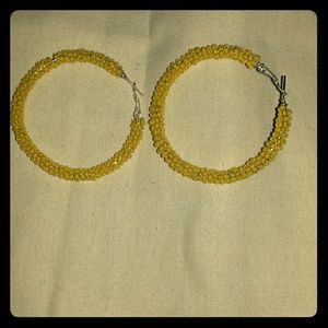 Sexy yellow hoop earrings for pierced ears .
