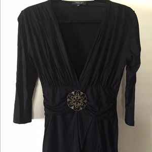 Vertigo top. Low cut, very flattering!