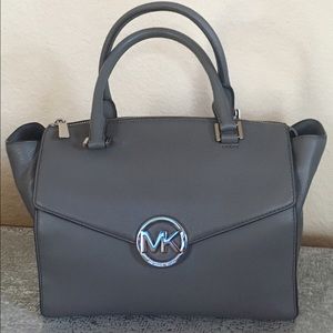 Michael Kors gray and silver handbag.