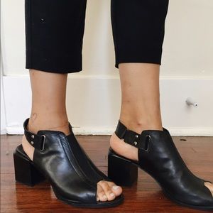 Black open-toes booties.