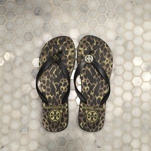 Tory Burch leopard print flip flop sandals.