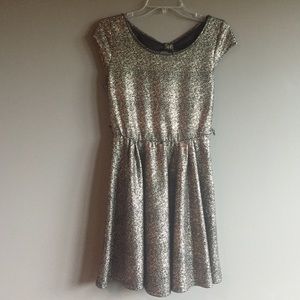 Short, shiny, gold and black party dress
