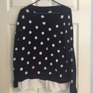 Sweater with shirt tail hem.