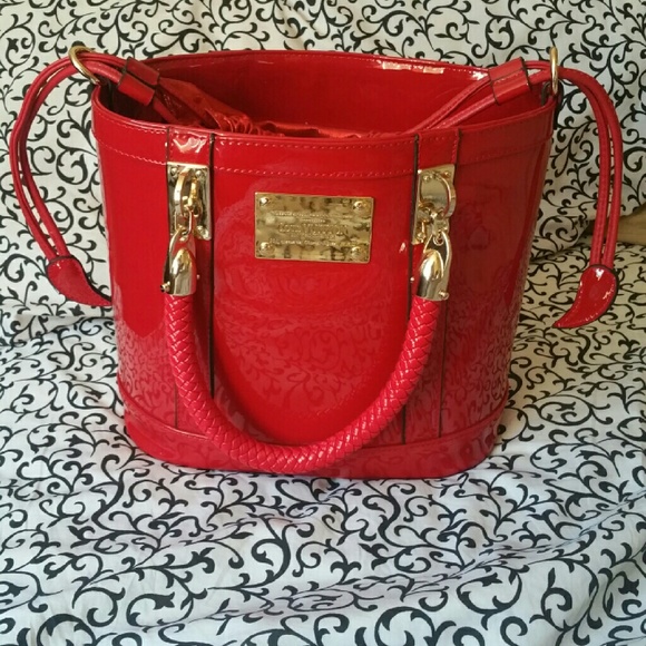 Red patent leather tote handbag