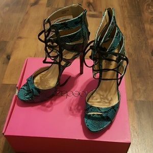 Teal and black snakeskin pattern lace up heel