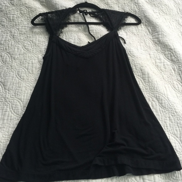 Black blouse with romantic lace sleeves.