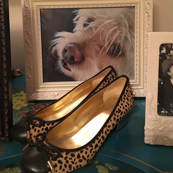 Ivanka Trump leopard gold heel shoes.