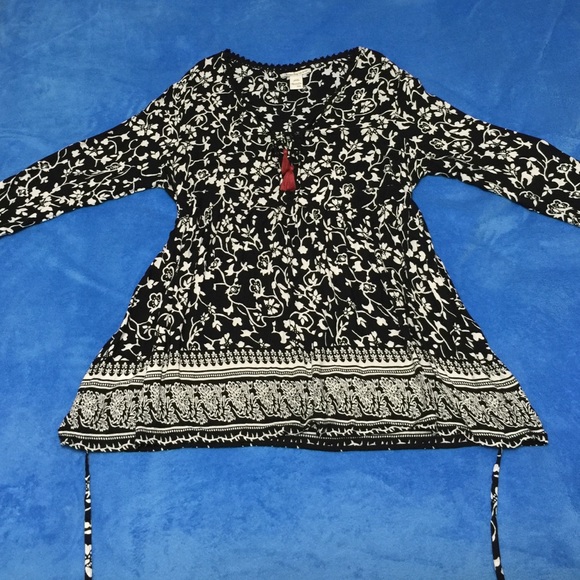 Rayon tunic with tie back at waist.
