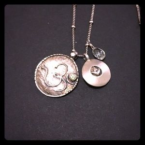 Silver lotus, om, and green topaz necklace