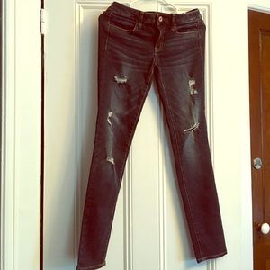 Dark, destroyed, AE jeggings.