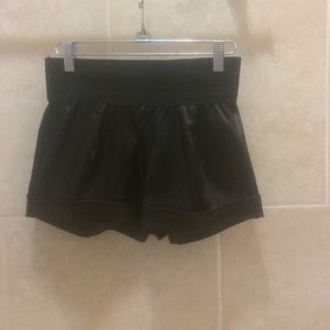 Short black leather pants
