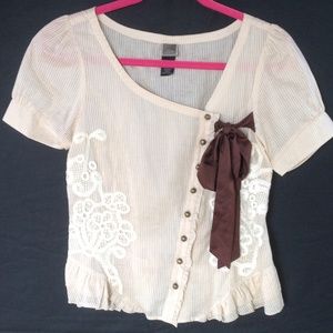Asymmetrical button down blouse.