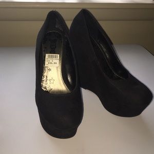 Never worn Black suede pumps
