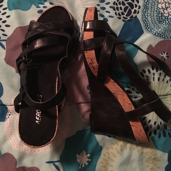 Black strappy wedge sandals.