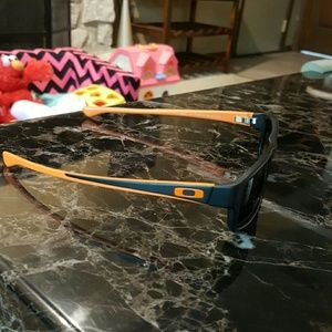 Black & Orange Tail Spin Oakley sunglasses
