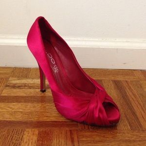 Red silk pumps