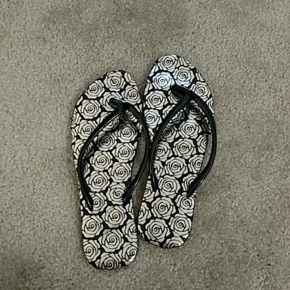 Cute flip flops with rose print design.