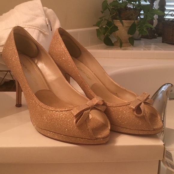 Caparros gold peep toe platform pumps size 9 1/2