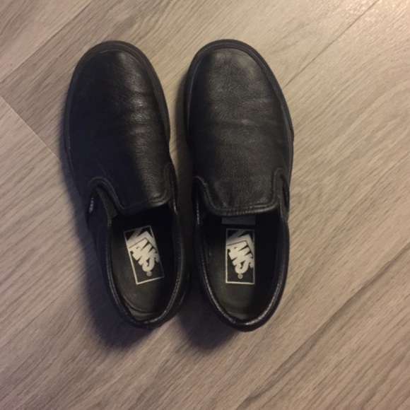 Black on black Vans Slip-Ons