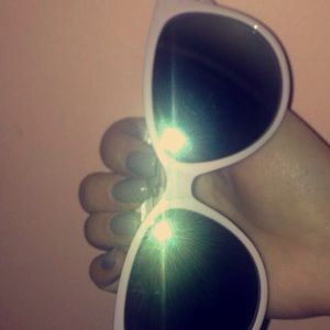 Pink sunglasses gold on the side greenish lenses