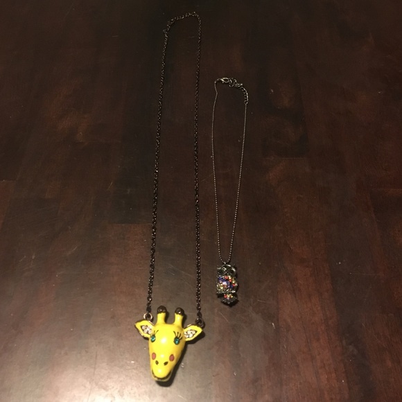 Cute giraffe, and owl necklaces.