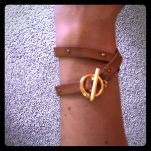 Leather and gold colored wrap bracelet