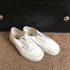 White low top Vans with laces