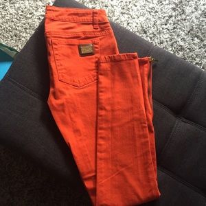 Michael Kors orange skinny jeans