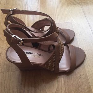 Brand new. Never worn tan wedge sandals