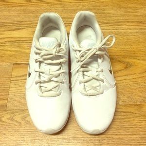 All white Nike tennis shoes