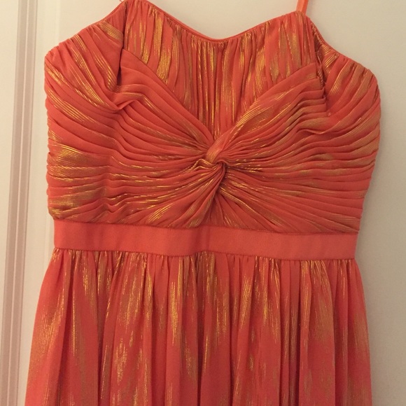Full length coral and gold strapless gown