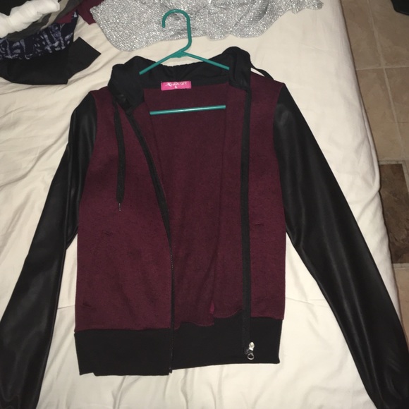 Sweater with faux leather sleeve and details