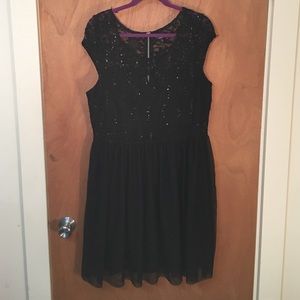 Sequined little black dress with sheer waist