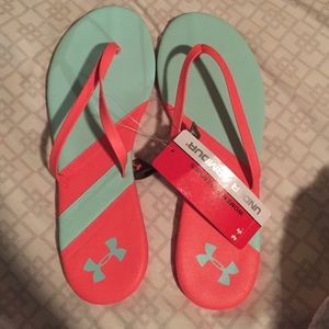 Under Armour flip flops.