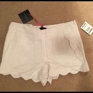 White scalloped "trouser" shorts